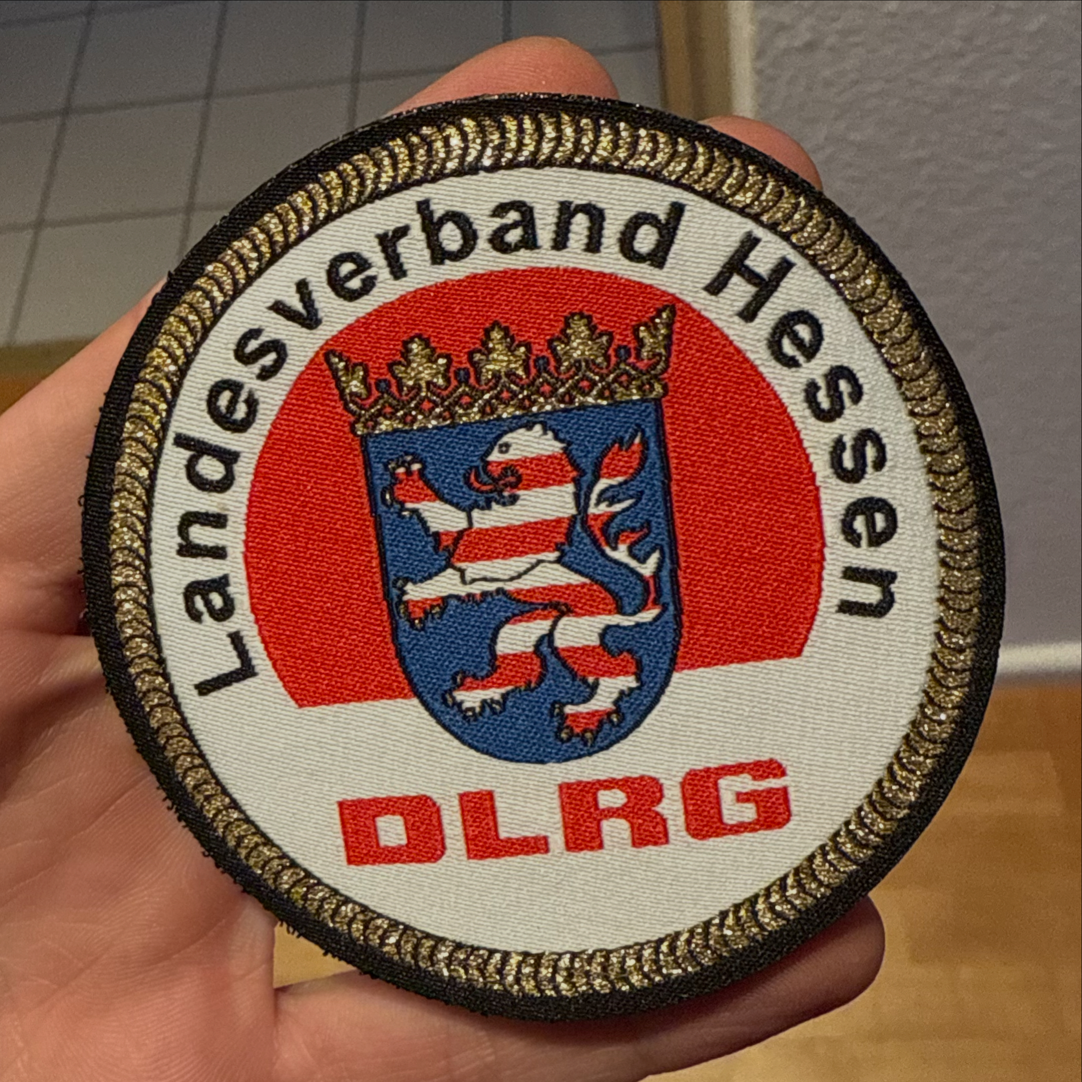 Runder Patch des DLRG Landesverbands Hessen mit Hessenwappen